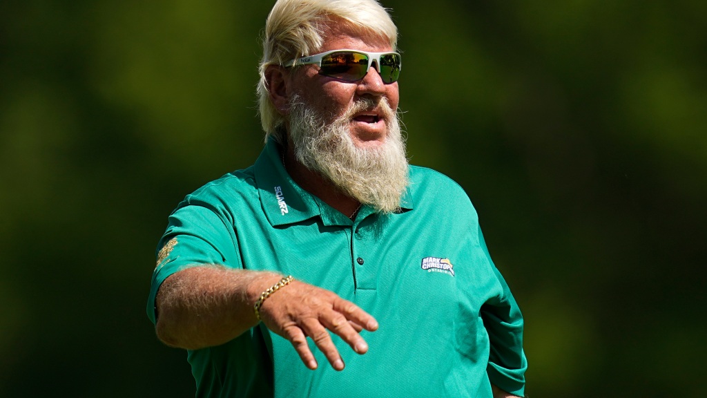 A barefoot John Daly hit a golf ball over an Ohio highway