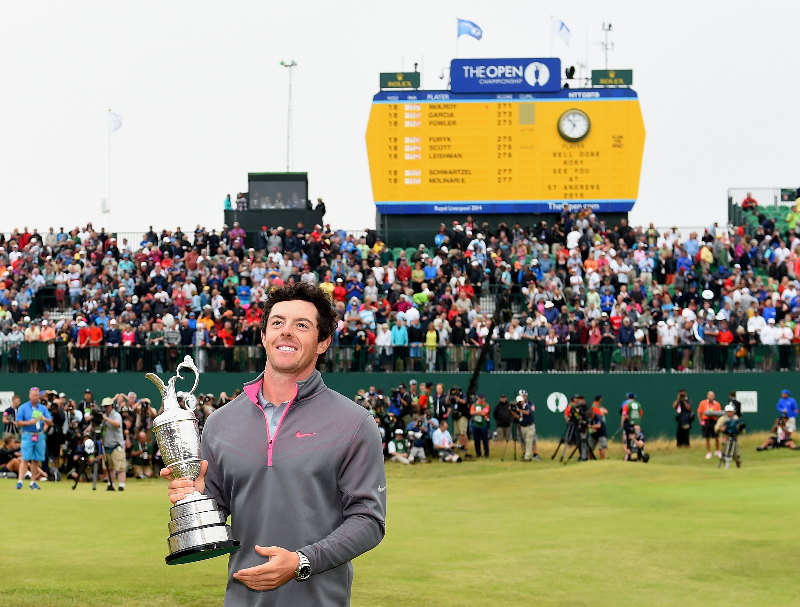 HOYLAKE, ENGLAND - JULY 20: Rory McIlroy of Northern Ireland celebrates with the Claret Jug after his two-stroke victory after the final round of The 143rd Open Championship at Royal Liverpool on July 20, 2014 in Hoylake, England. (Photo by Ross Kinnaird/R&A/R&A via Getty Images)
