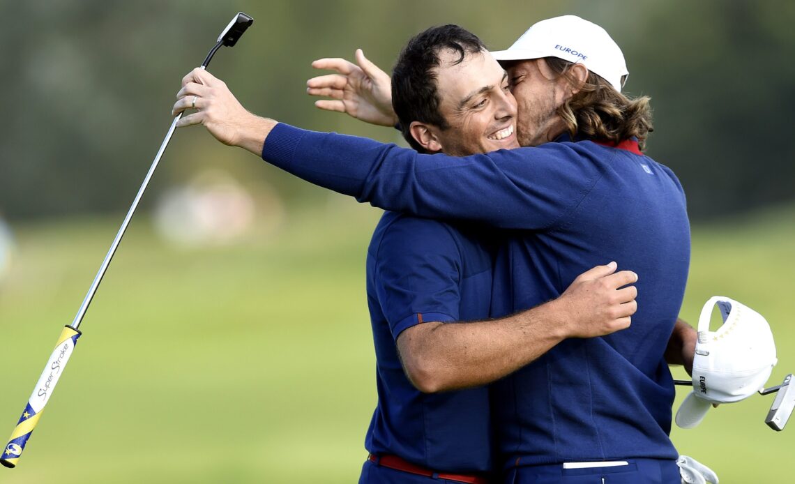 Sep 28, 2018; Paris, FRA; Europe golfer Francesco Molinari celebrates with Europe golfer Tommy Fleetwood after winning their match during the Ryder Cup Friday afternoon matches at Le Golf National. Mandatory Credit: Ian Rutherford-USA TODAY Sports