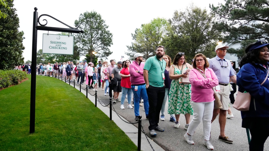 Line for Masters Golf Shop stretches beyond range