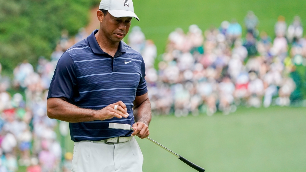 Tiger Woods must wait to make Masters history after weather delay