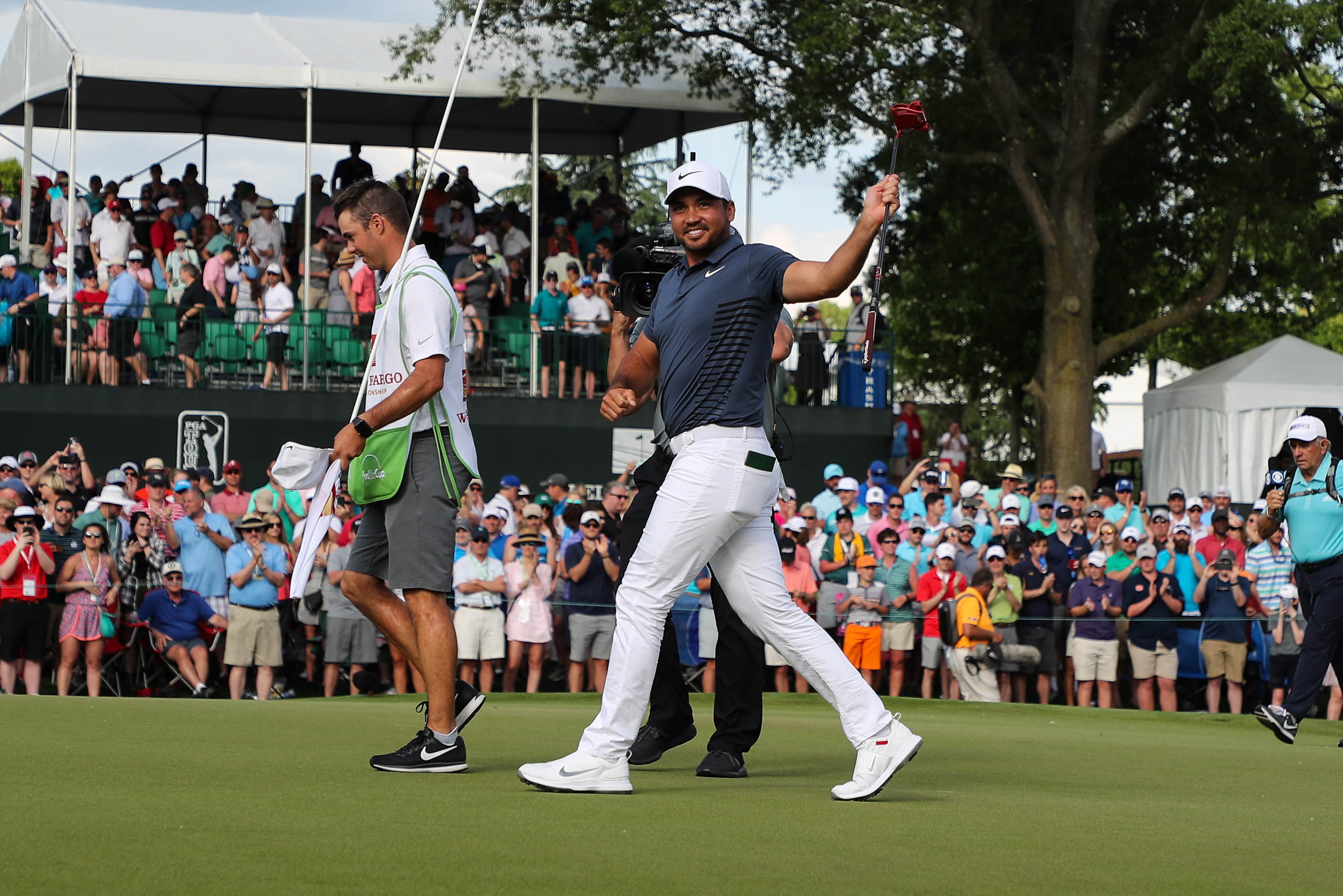 May 6, 2018; Charlotte, NC, USA; Jason Day reacts to his winning putt on 18 during the final round of the Wells Fargo Championship golf tournament at Quail Hollow Club. Mandatory Credit: Jim Dedmon-USA TODAY Sports