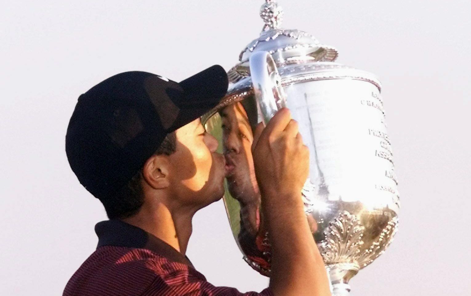 LOUISVILLE, : Golfer Tiger Woods of the US kisses the Wanamaker trophy 20 August, 2000 after winning the 82nd PGA Championship at Valhalla Golf Club in Louisville, KY. Woods won a three hole playoff with Bob May to become the first player since 1953 to win three majors in one season. (ELECTRONIC IMAGE) AFP PHOTO/Matt CAMPBELL (Photo credit should read MATT CAMPBELL/AFP/Getty Images)