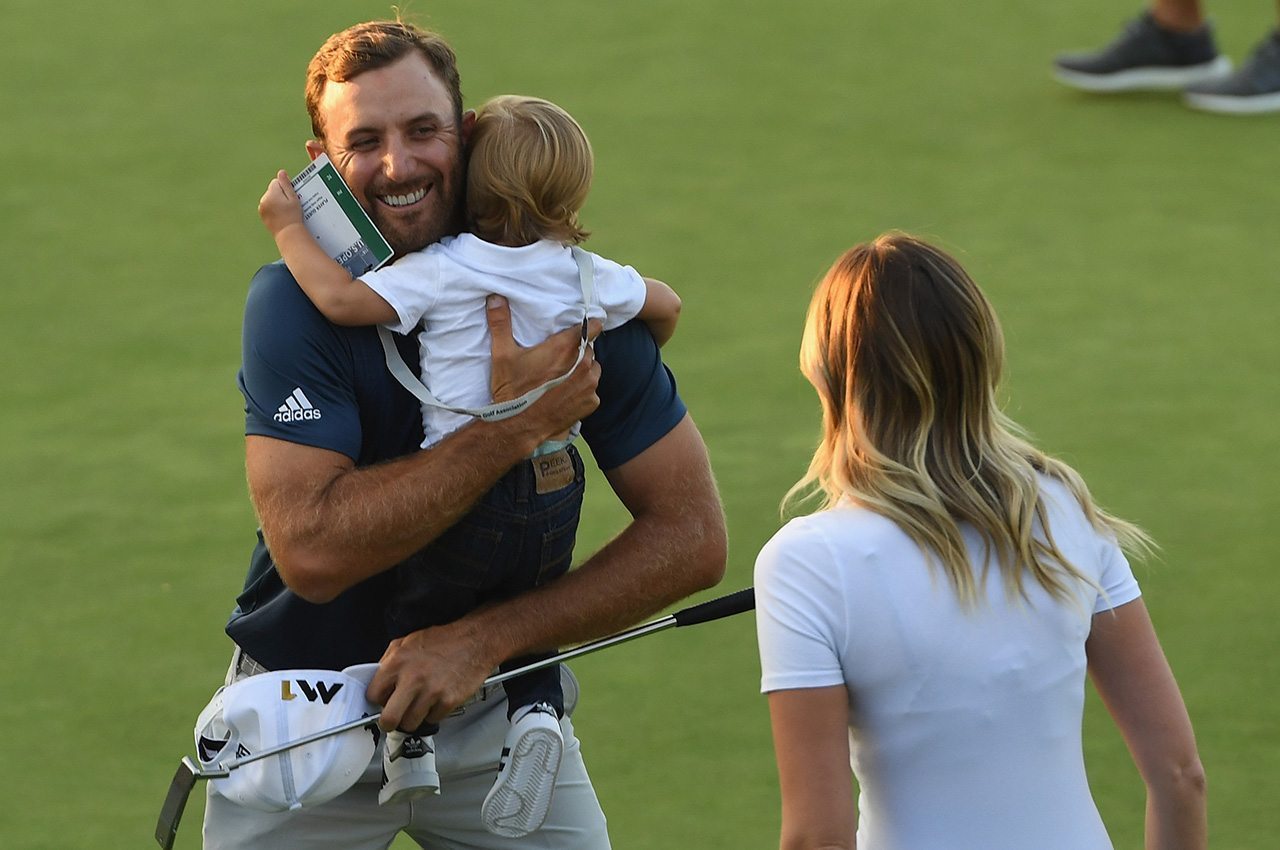 OAKMONT, PA - JUNE 19: Dustin Johnson of the United States celebrates with partner Paulina Gretzky and son Tatum after winning the final round of the U.S. Open at Oakmont Country Club on June 19, 2016 in Oakmont, Pennsylvania. (Photo by Ross Kinnaird/Getty Images)