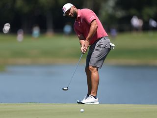 Jon Rahm hits a putt at LIV Golf Miami