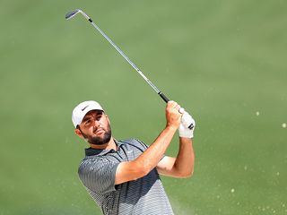 Scottie Scheffler hitting an iron shot at Augusta National