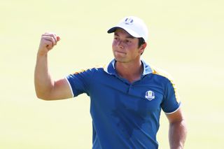 Viktor Hovland celebrates winning his singles match at the 2024 Ryder Cup