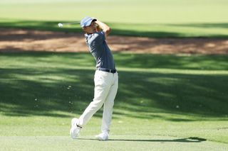 Collin Morikawa hitting a golf shot at Augusta National