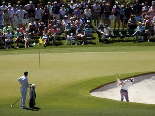 Scottie Scheffler hitting a bunker shot at Augusta National