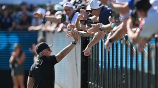 LIV Golf CEO Greg Norman high-fiving fans at LIV Golf Adelaide 2024