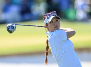 Jasmine Koo hits a tee shot with a driver