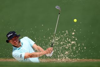 Peter Malnati plays a bunker shot