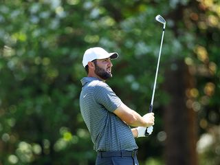 Scottie Scheffler hitting an iron shot at Augusta National