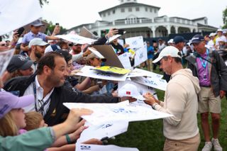 Rory McIlroy signs autographs for fans at the 2024 PGA Championship