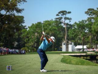 PGA Tour winner Nick Taylor hitting an iron shot on the fairway