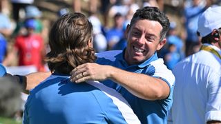 Tommy Fleetwood and Rory McIlroy celebrate victory in their Friday foursomes Ryder Cup match