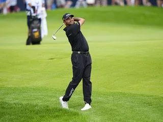 Jason Day demonstrating a balanced finish position at the end of his golf swing