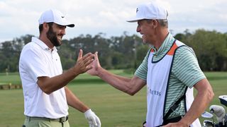 Scottie Scheffler and Ted Scott celebrate after Scheffler's Players Championship victory