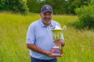 Angel Cabrera holds a trophy