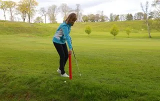 Moving red stake on golf course