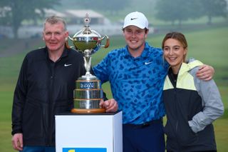 (From L to R) Dougie MacIntyre, Robert MacIntyre, and Shannon Hartley pose next to the RBC Canadian Open trophy