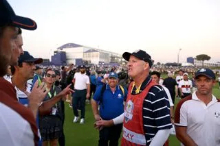 Joe LaCava speaks to members of team Europe at the Ryder Cup
