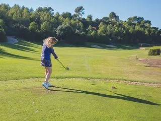 Golf Monthly Top 50 Coach Katie Dawkins demonstrating engaging lower half of body in the golf swing