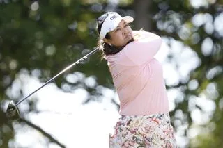 Lilia Vu hits a driver and watches her tee shot