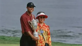 Tiger Woods from the United States stands alongside his mother Kultida Woods holding the United States Golf Association Open Championship trophy after winning the 100th United States Open golf tournament on 18th June 2000.