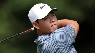 Tom Kim takes a tee shot at the Travelers Championship