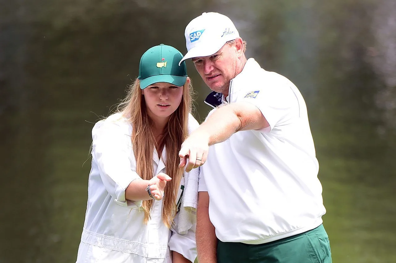 Ernie Els lines up a putt for his daughter Samantha Els during the Par 3 Contest prior to the start of the 2016 Masters Tournament at Augusta National Golf Club.