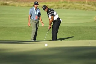 Tiger Woods practices putting from off the green ahead of the 2024 US Open