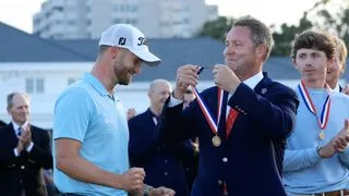 Mike Whan presents Wyndham Clark with a medal after winning the US Open