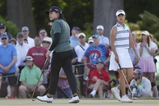 Wichanee Meechai and Andrea Lee on the 18th green