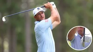 Bryson DeChambeau hits an iron shot and points to the face of them