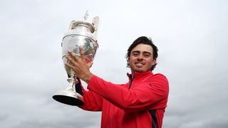 Jacob Skov Olesen holds aloft The Amateuer trophy