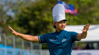 Min Woo Lee wears a chef's hat while addressing the crowd on the 17th green at the 2023 Australian PGA Championship