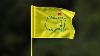 A yellow Masters flag blows in the wind