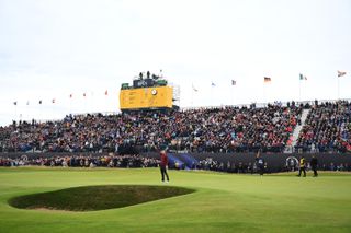 Justin Rose celebrates a putt in front of the grandstands at Royal Troon 2024