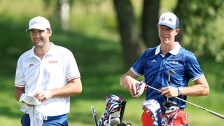 Scottie Scheffler and Ted Scott during a practice round before the Olympics