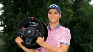 Adrien Dumont de Chassart poses with the trophy after winning the BMW Charity Pro-Am