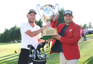 Thriston Lawrence and his caddie with the European Masters trophy