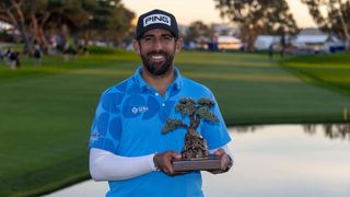 Matthieu Pavon with the Farmers Insurance Open trophy