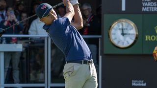 Collin Morikawa takes a shot during the Presidents Cup