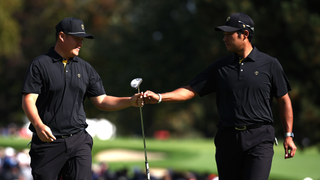 Sungjae Im and Hideki Matsuyama fist pump on the green