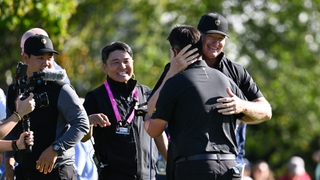 Ernie Els hugs Sungjae Im after winning his match