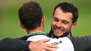 Laurie Canter celebrates winning the European Open with his caddie