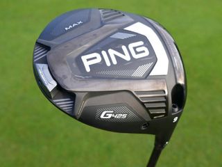 Ping G425 Max Driver, ping driver on grass background, black driver