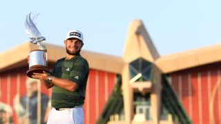 Tyrrell Hatton holds the Abu Dhabi HSBC Championship trophy in 2021