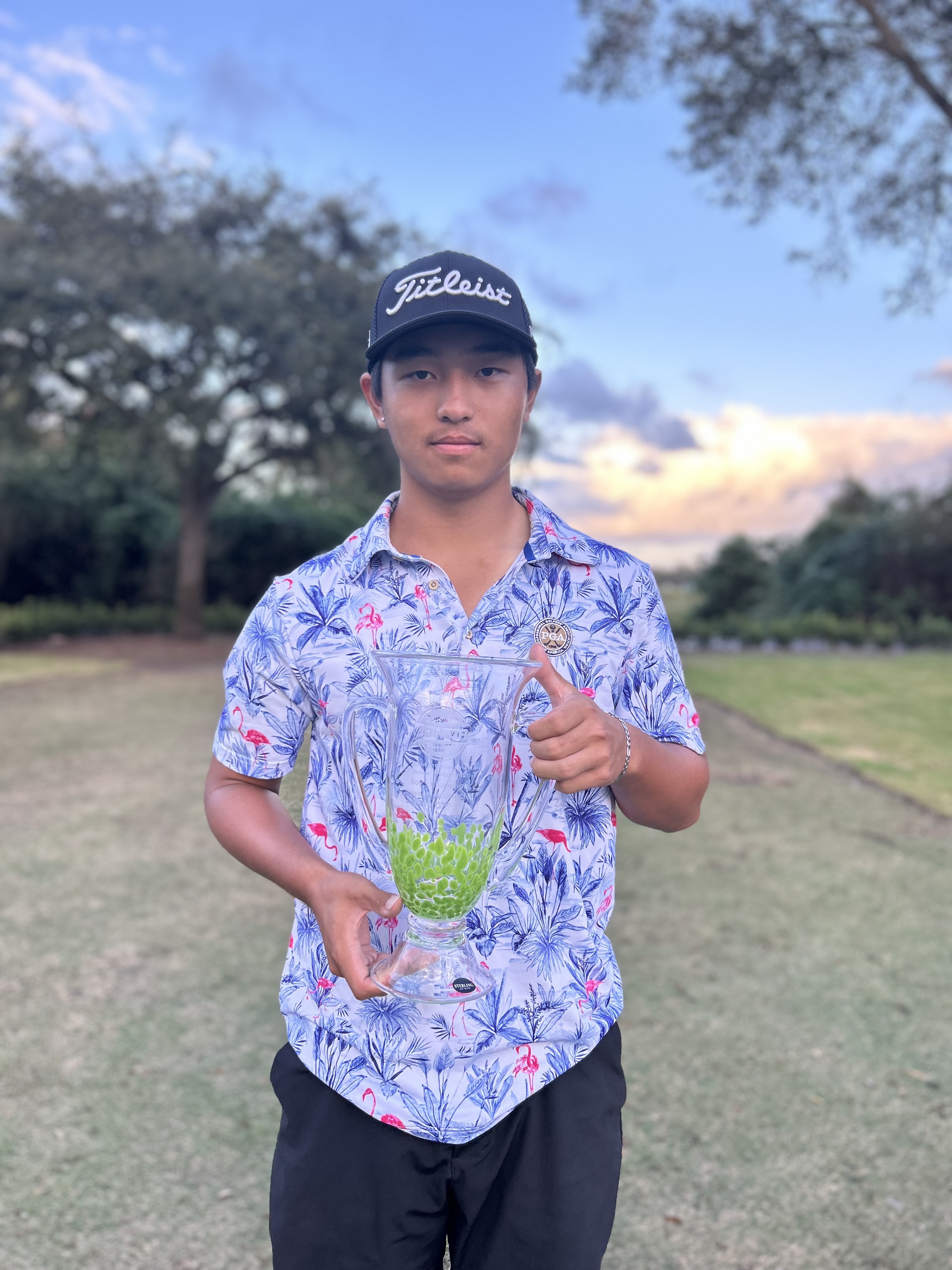 Junzhe Wang after winning the boys' title.